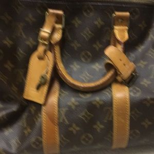 Louis Vuitton travel bag with dust bag